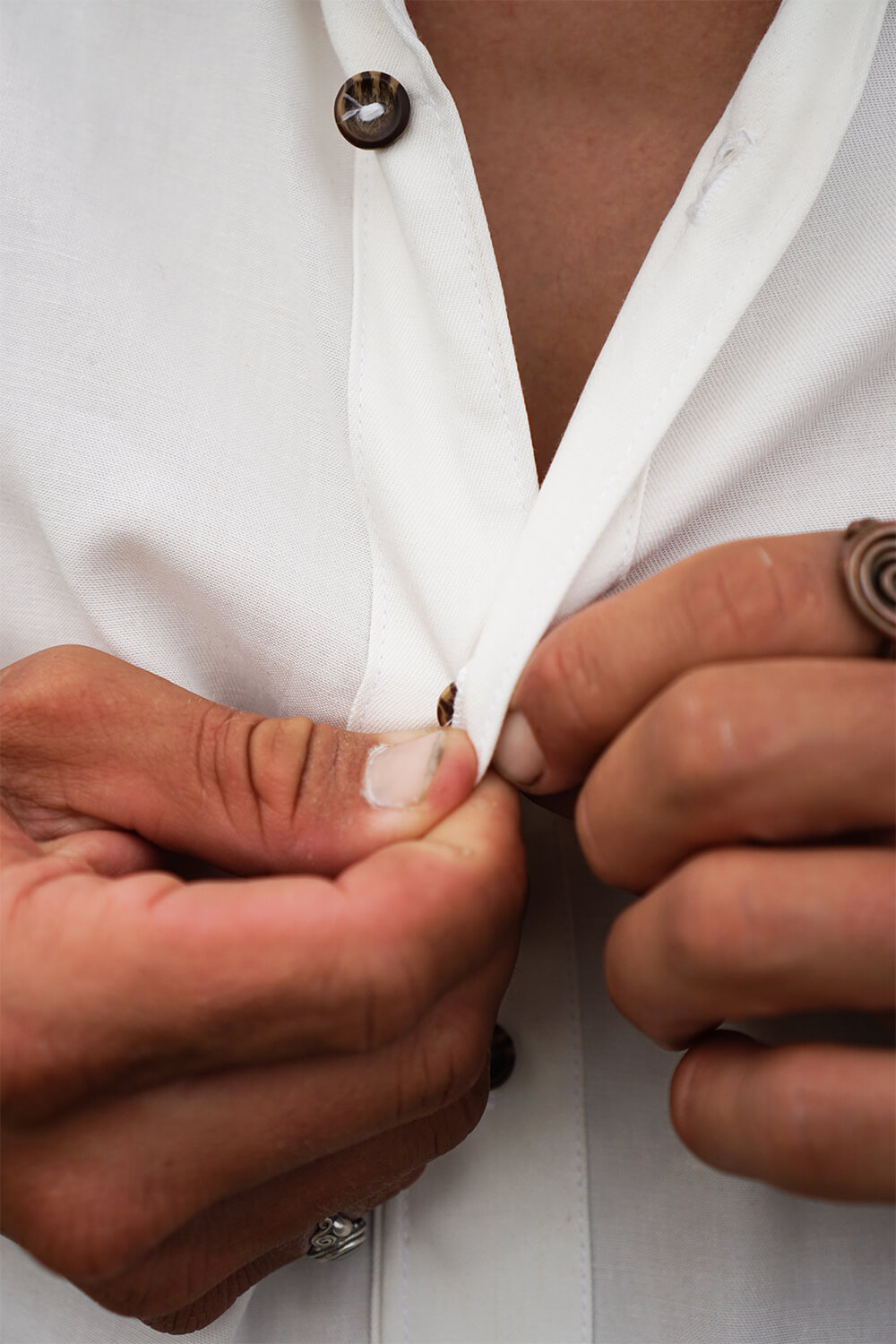 Tasi Travels' Men's White Long-Sleeve Voyager Shirt is handmade from a sustainable Tencel & hemp blend