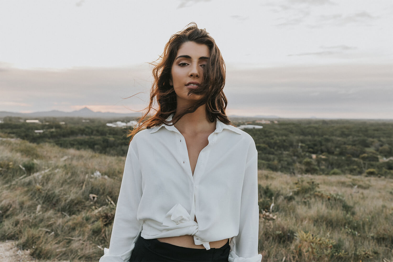 Tasi Travels' Women's White Voyager Shirt is handmade from sustainable Tencel