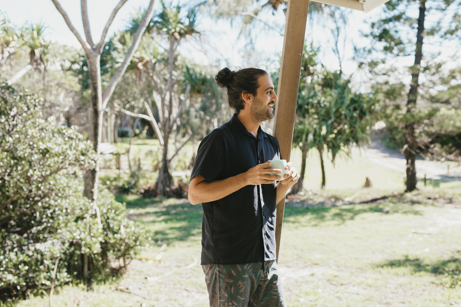 Tasi Travels' Men's Black Short-Sleeve Voyager Shirt is handmade from sustainable Tencel